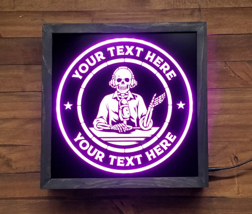 Let everyone know when you're live with our customizable Livestream/On Air Recording LED Sign. Featuring a sleek engraved black acrylic front and wood frame, this sign comes with a 44 key remote with 20 colors to customize the top and bottom lines. With solid, flash, and fade through color options, this sign is perfect for any YouTuber or livestreamer. Easy to set up with the included power cord. Make a statement with our Livestream/On Air Recording LED Sign