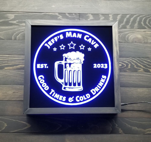 Elevate your home bar with our personalized beer LED sign! Customize the top and bottom lines to make it truly your own. With a sleek black acrylic design in a wooden frame, this sign is perfect for beer lovers and adds a touch of personality to any room. The LED lights change color with the included remote control, so you can create the perfect ambiance for any occasion. Get yours today and take your home bar to the next level!