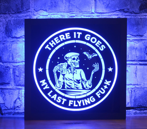 Skeleton LED Sign - 'Where It Goes - A Skeleton's Last Flying F*ck'. Crafted for laughter, this comical sign is the perfect conversation starter for your home, bar, or man cave