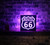 Route 66 LED Sign with Handcrafted Wooden Frame and Striking Black Acrylic Design, illuminated in vibrant colors - A captivating decor piece for enthusiasts, showcasing the iconic Mother Road in a mesmerizing glow