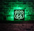 Route 66 LED Sign with Handcrafted Wooden Frame and Striking Black Acrylic Design, illuminated in vibrant colors - A captivating decor piece for enthusiasts, showcasing the iconic Mother Road in a mesmerizing glow
