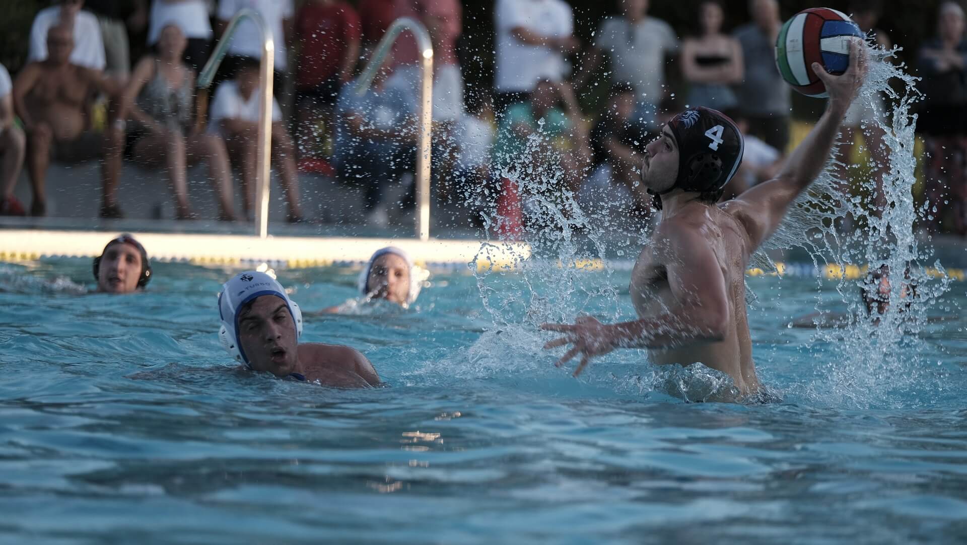Water polo players and ball