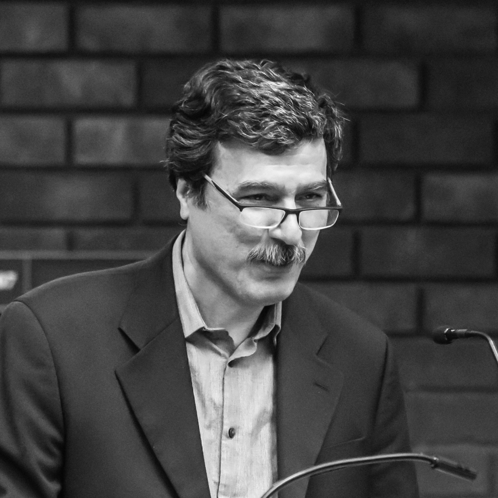 Author Behrooz Ghamari giving a speech