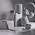 Selection of grey wireless audio devices: headphones, speakers, earbuds, and chargers.