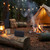 Black portable Bluetooth speaker on log by campfire and tent