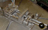 A 6-SV with fixturing, set-up under a drill. The open position, no part installed. This fixture can handle two different sized parts.