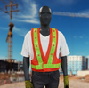 Construction worker wearing a reflective safety vest on a job site for workplace safety and visibility compliance.