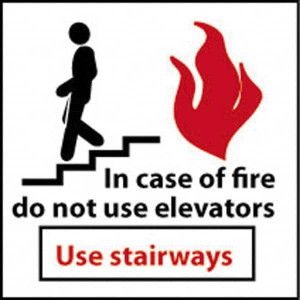AccuformNMC In Case of Fire - Do Not Use Elevators - Use Stairways, Plastic Fire and Exit Sign 7" Wide x 7" High S31R - 63370662