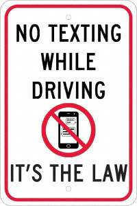 AccuformNMC "No Texting While Driving Its The Law," Strike on Cell Phone, 12" Wide x 18" High Aluminum Warning & Safety Reminder Sign 0.08" Thick, Red & Black on White, Rectangle, Engineer Grade Reflectivity, Post Mount TM252J - 37650900