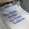 Disposable paper floor mat white with blue ink states We Take Pride in Your Vehicle