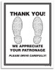 Disposable paper floor mat says THANK YOU! WE APPRECIATE YOUR PATRONAGE PLEASE DRIVE CAREFULLY