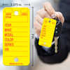 Yellow Poly Key Tags with dimensions 1.375 in x 3 in, tag is attached to car key with metal key ring.