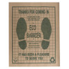 Brown paper floor mat with dark green print states "Thanks for coming in" and "It has been a pleasure to serve you". Other text explains mat is made from recycled materials.