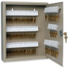 Slotted numbered key tags hang in key cabinet with keys attached