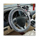 Disposable clear plastic steering wheel cover wraps around standard size steering wheel using 2 elastic bands.