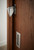 Sliding Barn Door Latch (Satin Finish) mockup on wood door