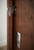Sliding Barn Door Latch (Polished Finish) mockup on wood door