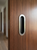 One-Sided 6-5/16" Pressure Fit Recess Pull Handle, Snap-In, for Wood Doors - Oval (Brushed Satin Stainless Steel) mockup on door