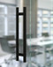 Pro-Line Series: Ladder Pull Handle - Back-to-Back, Oil Rubbed Bronze Finish, 304 Grade Stainless Steel Alloy mockup on glass door