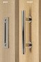 Barn Door Pull and Flush Tubular Door Handle Set  (Polished Stainless Steel Finish) mockup on wood door