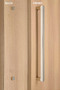 One Sided 1" x 1" Square Pull Handle with Decorative Thru-Bolt End Cap, Polished US32/629 Finish, 304 Grade Stainless Steel Alloy mockup on wood door