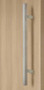 1" x 1" Square Ladder Pull Handle - Back-to-Back (Brushed Satin Stainless Steel Finish) mockup on wood door