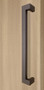 45º Offset 1.5" x 1" Rectangular Pull Handle - Back-to-Back, Bronze Finish, 304 Exterior Grade Stainless Steel Alloy mockup on wood door