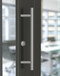 Pro-Line Series: 45º Offset Ladder Pull Handle - Back-to-Back, Brushed Satin US32D/630 Finish, 316 Exterior Grade Stainless Steel Alloy mockup on door