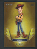 2026 Topps Disney Neon Genesis insert card featuring Woody from Pixar’s Toy Story with a gold Genesis-style parallel design.