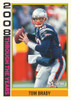 2026 Topps Heritage Football Through the Years insert featuring Tom Brady in his New England Patriots uniform.