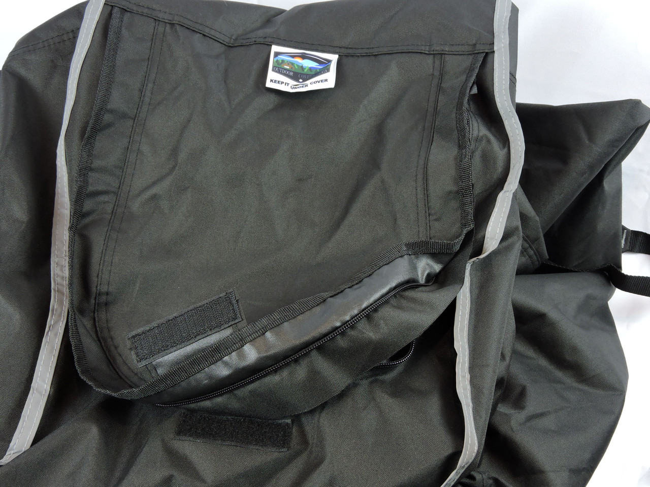 Protective flap for zipper with Velcro closure to ensure flap remains secure