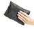 Sure Travel foldaway travel bag held in hand, showing its compact size when folded. The bag is designed for portability and convenience, easily expanding into a full-size travel bag when needed.