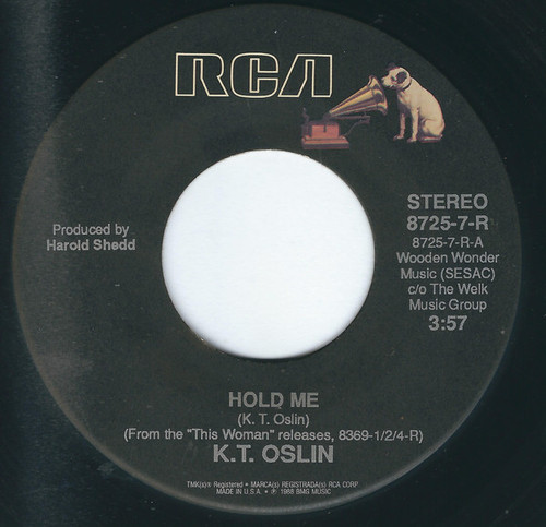 K.T. Oslin - Hold Me / She Don't Talk Like Us No More (7")