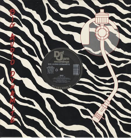 Big Audio Dynamite - Bad B/W The Bottom Line  (12", Single)