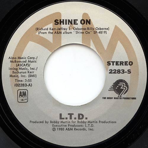 L.T.D. - Shine On / Love Is What You Need (7", Single, Pit)