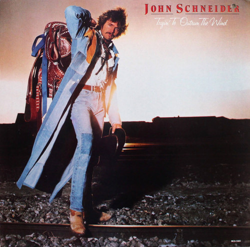 John Schneider - Tryin' To Outrun The Wind (LP, Album, Glo)_3634501446