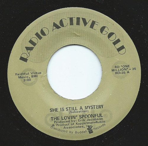 The Lovin' Spoonful - She Is Still A Mystery  (7", Single, RE)