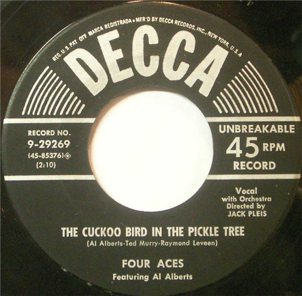 Four Aces* Featuring Al Alberts - It's A Woman's World / The Cuckoo Bird In The Pickle Tree (7", Single)