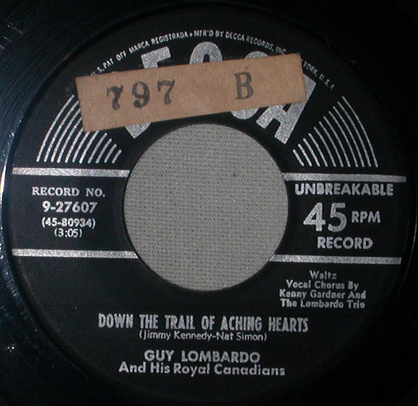 Guy Lombardo And His Royal Canadians - Down The Trail Of Aching Hearts / The Strange Little Girl (7")