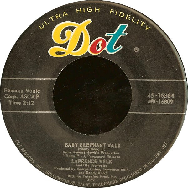 Lawrence Welk And His Orchestra - Baby Elephant Walk  / Theme From The Brothers Grimm (7", Single, Ind)