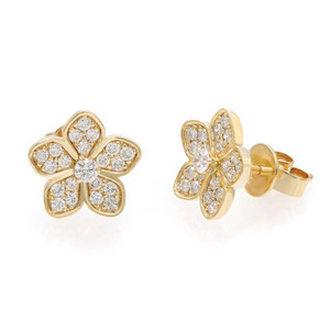 An image of a pair of Rachel Koen women's earrings with diamonds. The earrings are designed in the shape of a flower with five petals, set in yellow gold. Multiple small round cut diamonds embellish each petal, with a larger diamond in the center. The earrings are displayed against a white background, with one earring facing front and center while the other is angled to the side, revealing the gold post and backing. The earrings are in close-up view, showing detailed textures and the reflective quality of the diamonds.