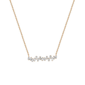 An image of a Rachel Koen women's necklace with diamonds, displayed frontally against a white background. The delicate yellow  gold chain runs horizontally across the top third of the frame, while a curved bar adorned with multiple sparkling baguette cut diamonds in various sizes and cuts is centered at the bottom. The necklace is presented in a close-up view, emphasizing the glittering stones and the contrast with the gold metal. The perspective is straight-on, providing a clear view of the jewelry's details.