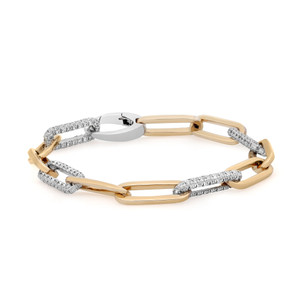 An image of a Rachel Koen women's bracelet with diamonds, presented at a slight angle and centered in the frame. The bracelet features alternating yellow gold links and pavé-set round cut diamond white gold links on a white background. The viewpoint is from above, capturing the bracelet's intricate design and the sparkle of the diamonds. The clasp of the bracelet is visible and polished, reflecting the light. The image is taken from a close distance, showcasing the details and craftsmanship of the jewelry.