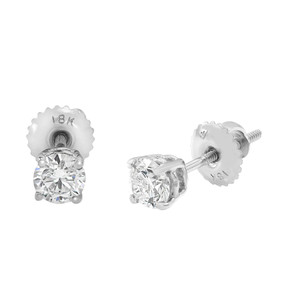 An image of a pair of GIA certified diamond stud earrings presented on a white background. The earrings are centered in the frame, with one earring positioned vertically on the left, showing the front view with a large, round-cut diamond set in a four-prong setting. The earring on the right is angled to display the side view, revealing the metal push back post and the notch on the post for securing the earring back. The earring backs are scalloped with "18K" embossed on them, indicating the metal purity.