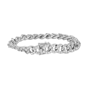 An image of a Rachel Koen women's bracelet with diamonds, showcased against a white background. The bracelet is positioned horizontally across the center of the frame, with a close-up view that emphasizes the intricate design and sparkling diamonds. The links are encrusted with round cut diamonds in white gold, providing a luxurious appearance, and the bracelet features a secure clasp on one end, visible to the viewer. The perspective is direct and level, offering a clear depiction of the bracelet's details and craftsmanship.