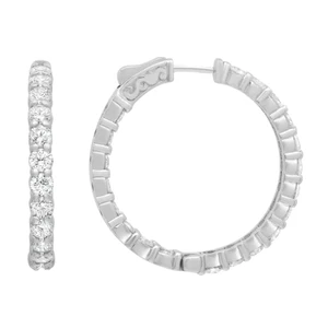 An image of a Rachel Koen brand earring designed for women, featuring diamonds. The earring is presented in a close-up view against a white background. On the left side of the image, the earring is shown in profile, revealing a row of sparkling round cut diamonds set in white gold metal with a polished finish. The right side of the image displays the earring from a front-facing angle, showcasing the full hoop design encrusted with diamonds inside out of its circumference. The earring exhibits a circular shape with a secure back closure visible at the top. The image is taken from a straight-on perspective, emphasizing the earring's intricate details and luxurious appearance.