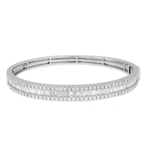 An image of a Rachel Koen women's bracelet with diamonds, displayed frontally at a mid-range distance on a white background. The bracelet is positioned horizontally in the center of the frame, showcasing a full view of the diamond-encrusted bracelet that glitters with round and baguette-cut stones set in a polished white gold metal. The clasp is visible on the right side, indicating the bracelet's functionality and elegance.