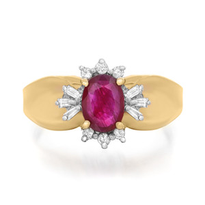 Front view of the ring with prong set center oval cut ruby with round and baguette cut diamonds set in white gold shank with yellow gold ring band