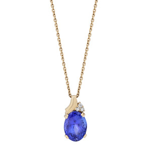Front view of the necklace with prong set blue oval cut tanzanite and round cut diamonds on top pendant with yellow gold link chain 