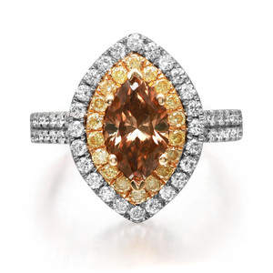 An image of a Rachel Koen women's ring with diamonds, featuring a prominent marquise-cut brown diamond in the center, surrounded by a double halo. The inner halo consists of round cut yellow diamonds set in a pear-shaped pattern, while the outer halo and band are adorned with smaller round cut white diamonds in white gold. The ring is shown in a close-up, top-down view that highlights the sparkle and intricate setting of the diamonds.